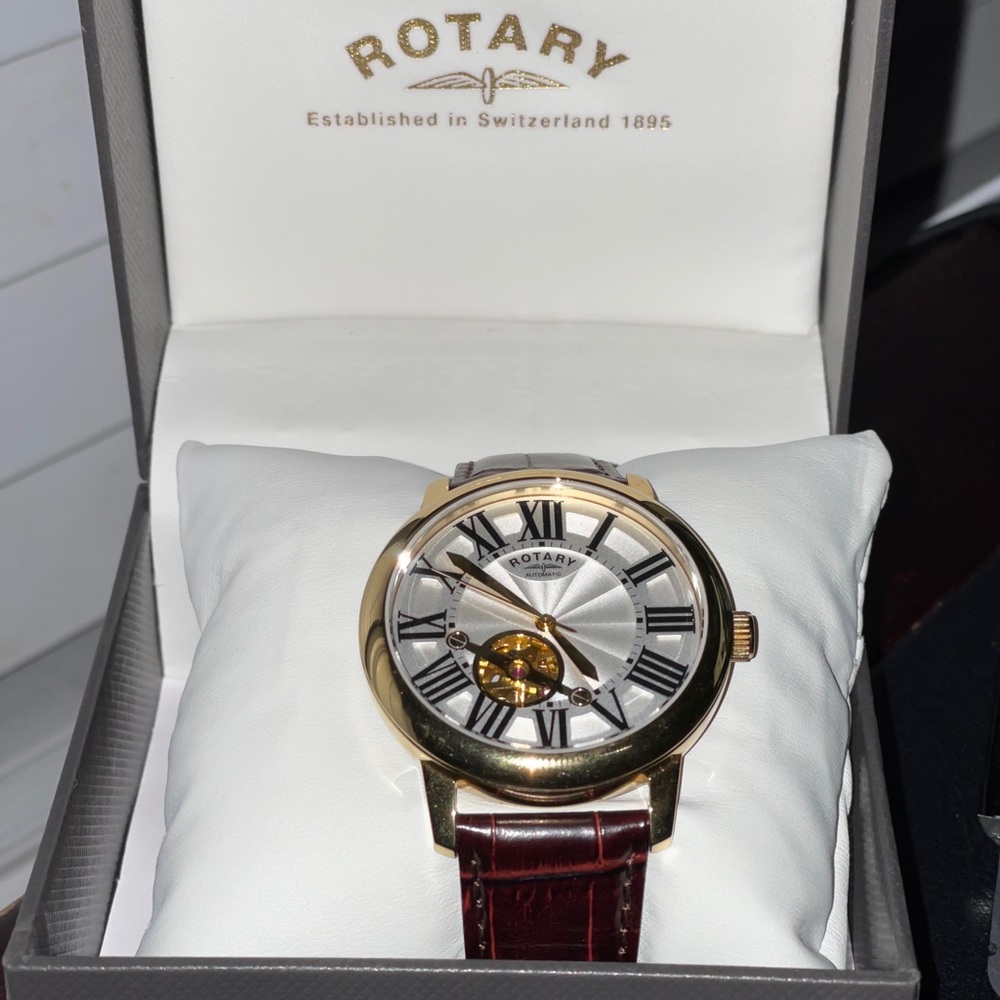 Gold face Genuine leather Rotary watch